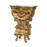 SMALL SHELF CONSOLE IN GILTWOOD, ELEMENTS OF THE BAROQUE PERIOD entirely sculpted to roccailles,