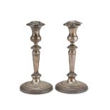 A PAIR OF SILVER CANDLESTICKS, PUNCH MILAN 1934/1944 with turned shafts and chiselled mouthpieces.