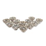TWELVE SILVER FRUIT BOWLS, PUNCH ROME 1872/1933 fluted body, with pearly edge. Silversmith Davide