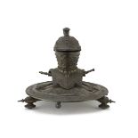 INKWELL IN BURNISHED METAL, 19TH CENTURY with armor and crossed swords. Measures cm. 20 x 19.