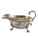 SMALL GRAVY BOAT IN SILVER, PUNCH LONDON 1900 with ribbon border and webbed feet. Silversmith Alfred