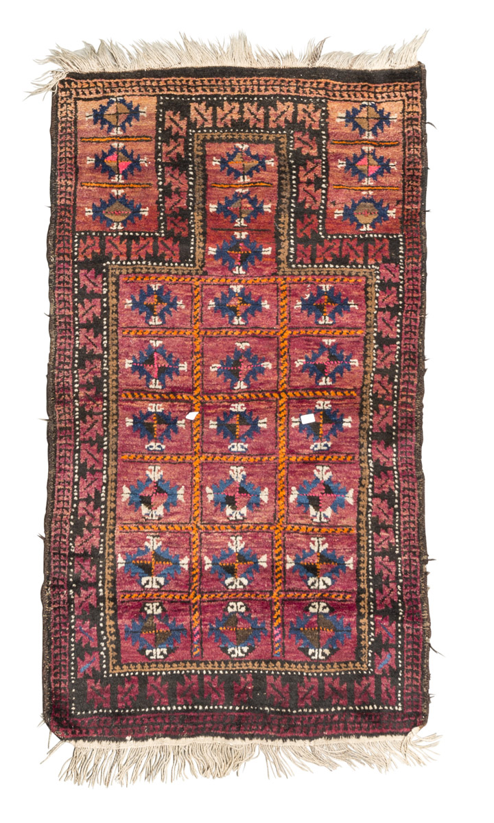 BELUCISTAN CARPET, EARLY 20TH CENTURY prayer design on red ground. Measures cm. 150 x 78. TAPPETO