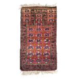 BELUCISTAN CARPET, EARLY 20TH CENTURY prayer design on red ground. Measures cm. 150 x 78. TAPPETO