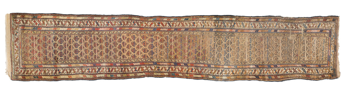 RARE CAUCASIAN KUBA RUNNER, LATE 19TH CENTURY with design of stylized flowers and claws, brown in