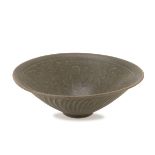 A CHINESE CELADON BOWL, EARLY 20TH CENTURY. decorated by engravings of floral interlacements and