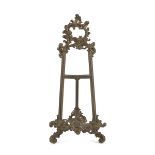 MIGNON EASEL IN BRASS, LATE 19TH CENTURY embossed with floral motifs. Measures cm. 42 x 20 x 5.