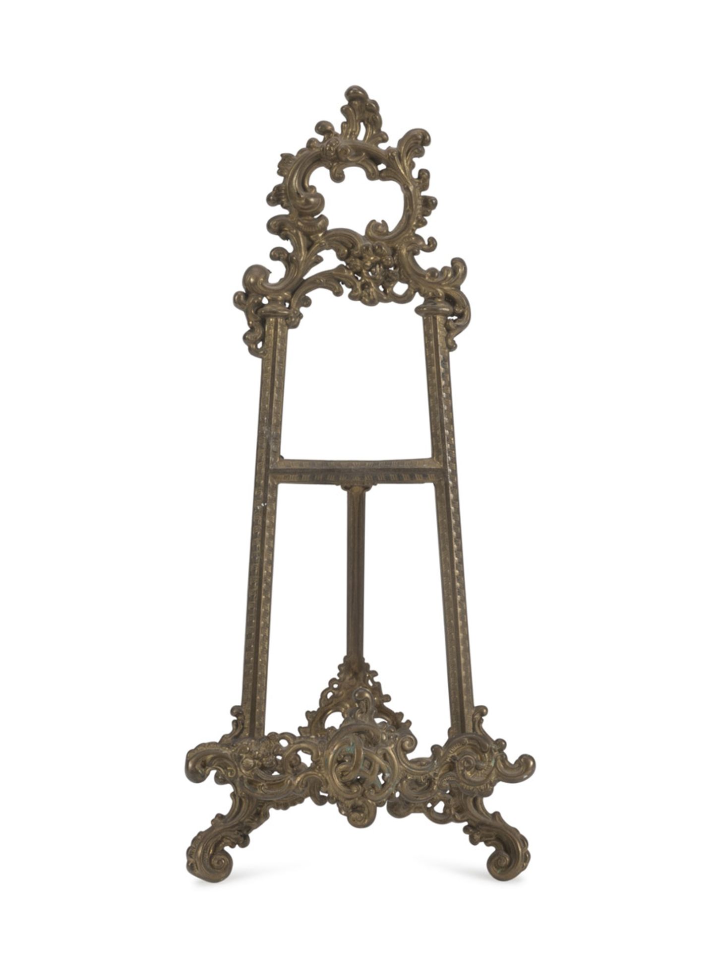 MIGNON EASEL IN BRASS, LATE 19TH CENTURY embossed with floral motifs. Measures cm. 42 x 20 x 5.