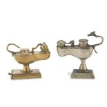 TWO OIL LAMPS IN ORMOLU AND SILVER-PLATED, 19TH CENTURY complete of wicks, with rectangular bases.