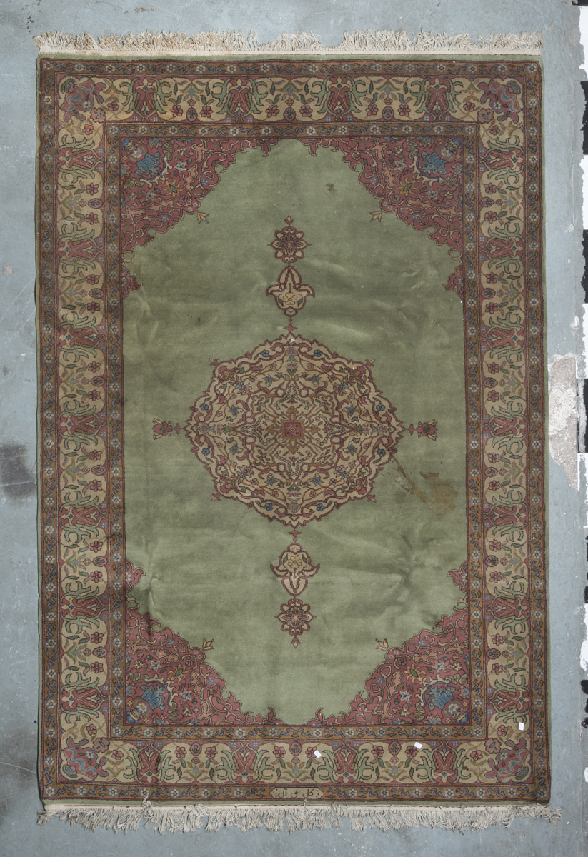 ARMENIAN CARPET, MID-20TH CENTURY with big flower medallion, in the center field on green ground.
