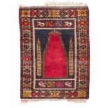 ANATOLIAN OBRUK CARPET, EARLY 20TH CENTURY with prayer design on red ground. Measures cm. 123 x