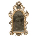 GILTWOOD MIRROR, PROBABLY VENICE, 18TH CENTURY Carved frame. Friezes sculpted into spiral scrolls,