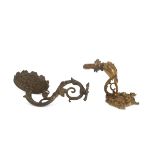 TWO WALL ARMS IN BRONZE, 19TH CENTURY SHAPE shaped to ramages and chiselled to leaves and palmettes.