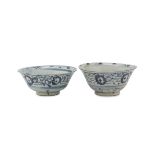 A PAIR OF CHINESE WHITE AND BLUE PORCELAIN BOWLS. 19TH CENTURY. decorated with bands of floral