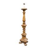 FLOOR CANDLESTICK, CENTRAL ITALY, 18TH CENTURY in light brown lacquered wood, with triangular shaft,