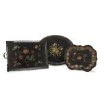 THREE TRAYS IN METAL, LATE 19TH CENTURY in black lacquer, polychromy and gold, with floral decorums.