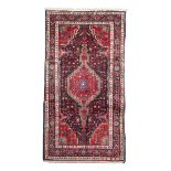 HAMADAN CARPET, EARLY 20TH CENTURY medallion with double niche and secondary motifs of shoots with