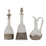 THREE BOTTLES IN GLASS AND SILVER, HOLLAND EARLY 20TH CENTURY stoppers and bases in silver chiselled