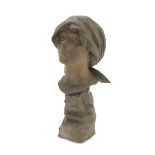 HEAD OF A WOMAN, NAPLES 20TH CENTURY in earthenware, with rock base. Measures cm. 55 x 26 x 30.