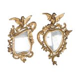 TWO SMALL MIRRORS IN GILTWOOD, EMILIA 18TH CENTURY with heart frames and cartouche and friezes