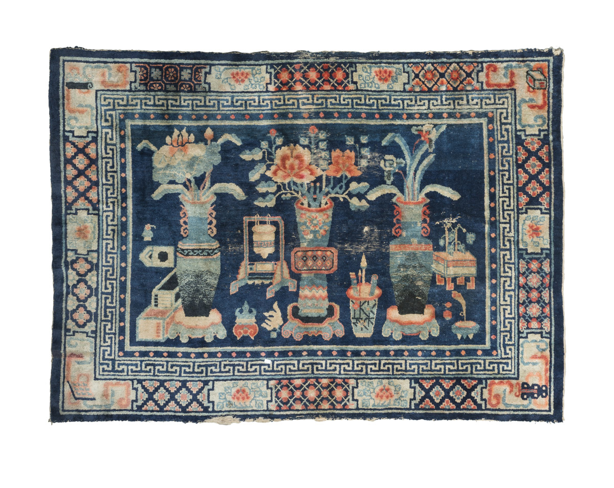 A CHINESE FIGURED CARPET. BEIJING 19TH CENTURY. with design of flower vases, brush holders and