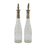 A PAIR OF GLASS BOTTLES, EARLY 20TH CENTURY silver-plated necks and caps engraved with floral