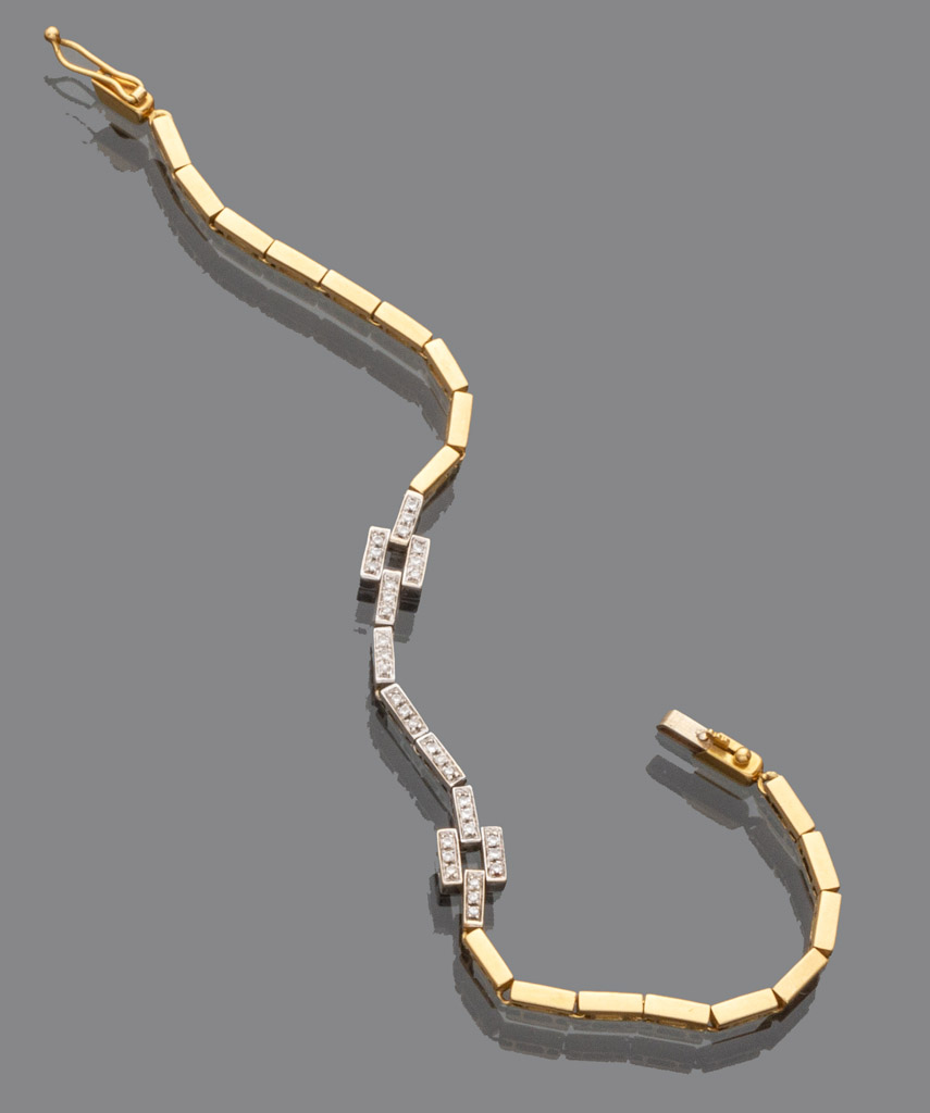 BRACELET in yellow gold 18 kts. with central geometric decoration in white gold with diamonds.