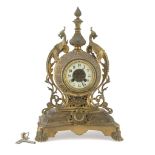 TABLE CLOCK IN BRONZE, LATE 19TH CENTURY case chiseled to motifs of roccailles, ramages and coat