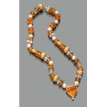 NECKLACE with pearls, glass and topazes with separators in gold 18 kts. Heart pendant. Length cm.