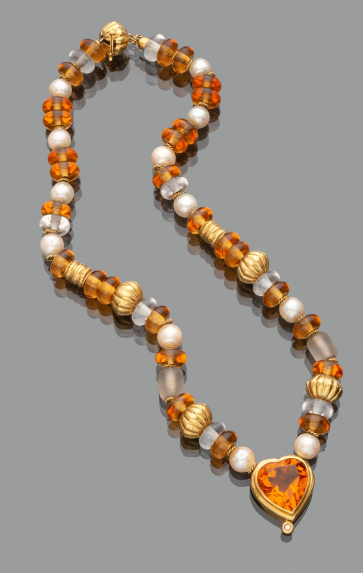 NECKLACE with pearls, glass and topazes with separators in gold 18 kts. Heart pendant. Length cm.