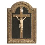 CHRIST IN IVORY, 18TH CENTURY with mobile arms. Applied on posthumous giltwood cross. Frame also