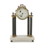 SMALL TABLE CLOCK, LATE 19TH CENTURY shaped as temple, in gilded metal, with metal columns with