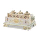 PORCELAIN INKWELL, 19TH CENTURY polychrome, orange and gold enamels, with three small basins and