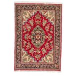 PERSIANO KUM CARPET, MID-20TH CENTURY medallion with flowers and secondary motifs of palmettes and
