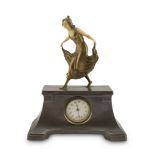 SMALL TABLE CLOCK, EARLY 20TH CENTURY with metal case and figure of dancer with face and arms in