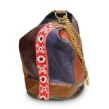 BUCKET PURSE, 1970S in leather of different colors with center braid and gilded chain shoulder