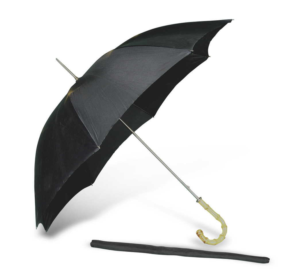 Umbrella, 1950s in black silk with handle in plastics to false bamboo. Complete of sheath. OMBRELLO,