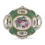 COOKIE DISH IN PORCELAIN, 19TH CENTURY in green and polychrom enamel, decorated with flower bunches.