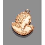 PENDANT in gold 12 kts. shaped as female bust and two inset diamonds. Measures cm. 4 x 3,5, ct. 0.