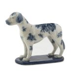 EARTHENWARE SCULPTURE, PROBABLY ENGLAND EARLY 20TH CENTURY in white and blue enamel, representing