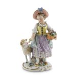 PORCELAIN FIGURE OF YOUNG FLOWER GIRL, GINORI, EARLY 20TH CENTURY polychrome enamelled. The figure