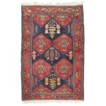 PERSIAN MOSSUL CARPET, EARLY 20TH CENTURY hexagonal medallions with symbolic motifs, flowers and