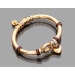 BANGLE in gold 18 kts. tubular shape with diamonds and heart pendants. Goldsmith Nouvelle Vague.
