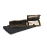 POWDER TIN AND TROUSSE, 1950s rectangular shape in brass with two compartments, case in black moiré.