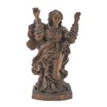 THE VIRGIN'S SCULPTURE, PROBABLY FRANCE 17TH CENTURY in carved oak. The figure is in praying pose