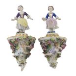 A PAIR OF PORCELAIN BRACKETS, GINORI EARLY 20TH CENTURY in polychromy, with figures of young