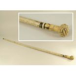 AMENDMENT: WHALE BONE (NOT NARWHAL) CANE.