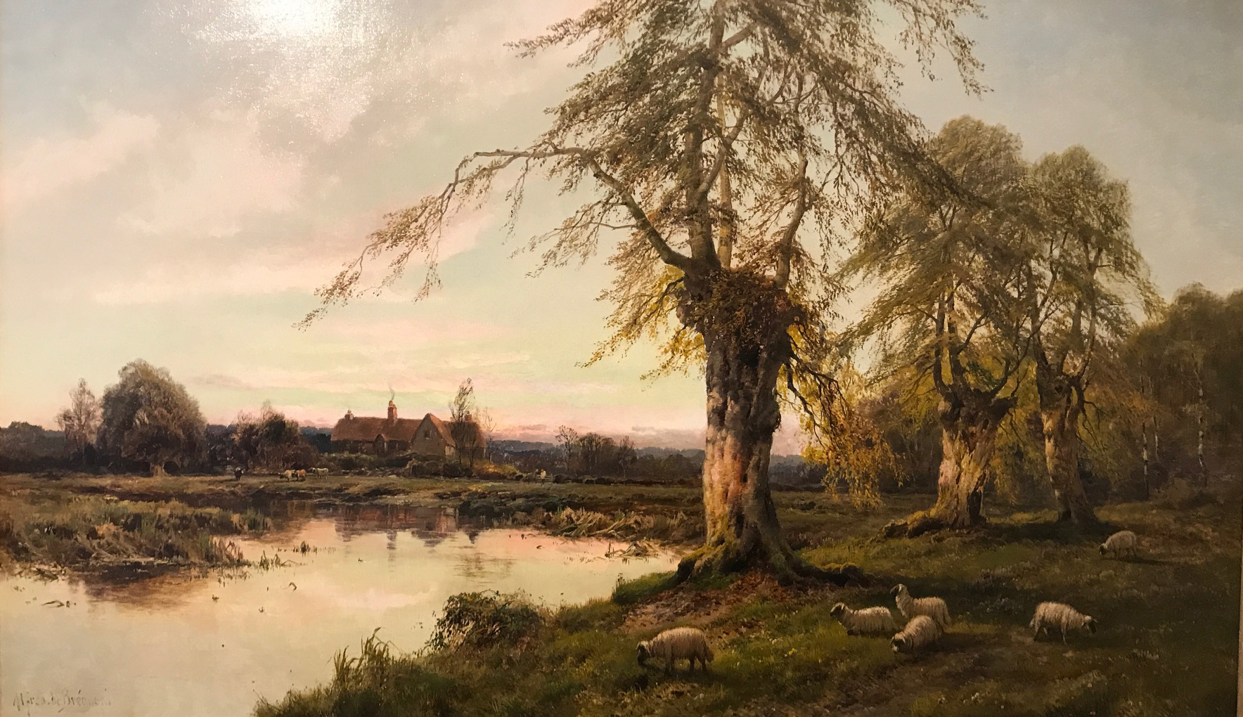 Alfred de Breanski (1852-1928)Sheep Grazing by the Lake, oil on canvas, signed,30" x 49".