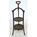 A Victorian mahogany two tier cake stand, with crossbanding and line inlay,