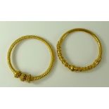 Two Bengal bangles, gold plated, one of a rope twist design, 52.8g.