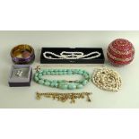 A large quantity of costume jewellery, including glass beads, rose quartz and green quartz,